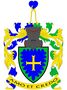 Pavel Kříž:V modrém štítě se zeleným trnovým lemem zlatý kotvicový kříž. Na kolčí přilbě s točenicí a přikryvadly vpravo modro-zlatými a vlevo zeleno-zlatými, postavené zlaté kovářské  kleště svírající modré srdce. Heslo: amó et credó (černým písmem na zlaté pásce, vpravo modře a vlevo zeleně podšité).