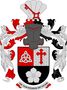 Petr Kubíček: Dělený štít, nahoře polcený, vpravo v červeném poli stříbrný symbol sv. Trojice, vlevo ve stříbrném kvádrovaném poli červený klíčový kříž, dole v černém poli stříbrný lotosový květ. Na kolčí přilbě s točenicí a přikryvadly vpravo červeno-stříbrnými a vlevo černo-stříbrnými obrácená stříbrná svatojakubská mušle, na níž kosmo položen červený klíč. Heslo: Aut viam inveniam aut faciam (černým písmem na stříbrné pásce, červeně podšité).